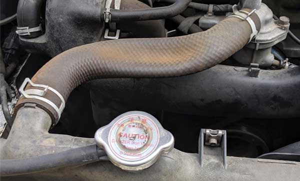 Car Worn-out Radiator Hose – Leaking Coolant