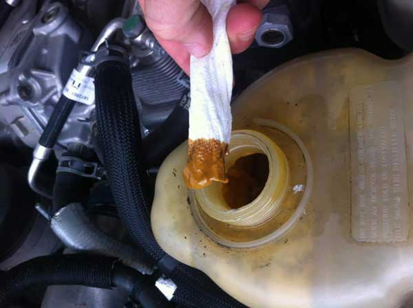 How To Diagnose the Cause of Oil In a Coolant Reservoir